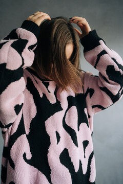 Anonymous woman in oversized sweater