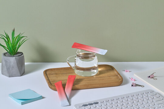 Modern Office Desk With Accessories and Refreshing Drink