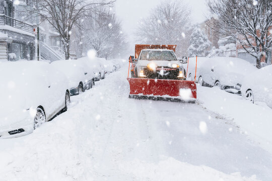 Snowplow in winter snowstorm