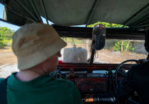 Tourists riding in a makeshift vehicle, Thailand