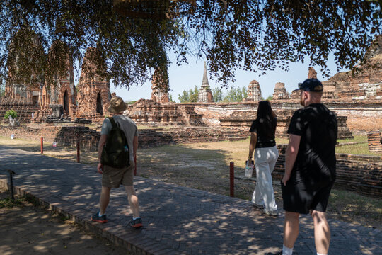 Tourists walking through the grounds of Wat Chaiwatthanaram, Ayutthaya