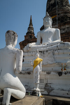 White stone statues at Thai temple.