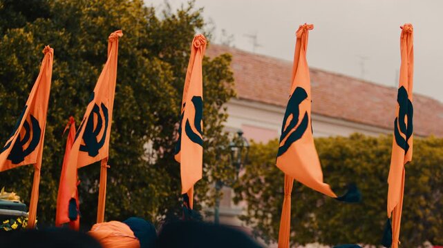 Flags symbolizing the Indian Sikh religion wave during the Vaisakhi parade