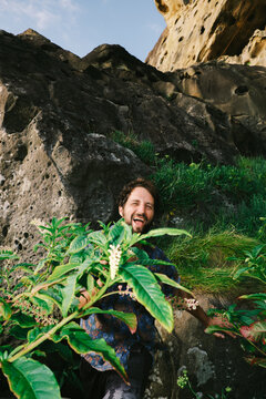 Man enjoying nature while exploring rocky area during daytime