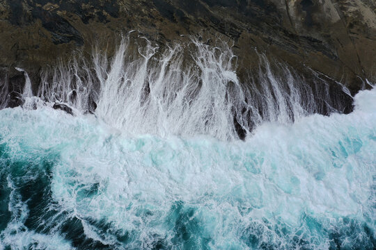 Waves smashing onto rocks. Whalers Way. South Australia.