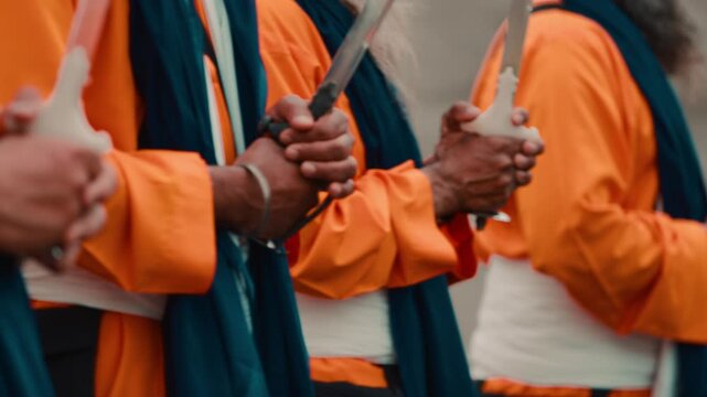 Indian soldiers with Kirpan defend the chariot with the sacred text during Sikh
