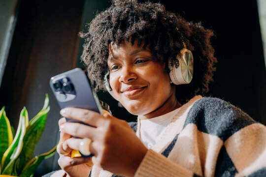 A woman using a mobile phone indoors