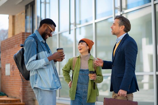 People talking outside a building in the city