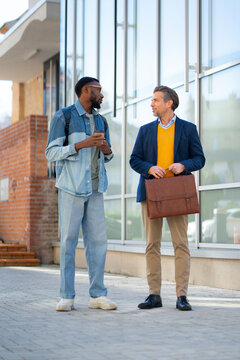 Business meeting outside a modern building