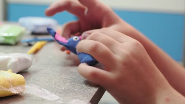 Little girls sculpt figurines crafts from air plasticine, modeling dough. Online lessons in tablet. Children's creativity hobby developing activities, training, learn of fine motor skills of hands.