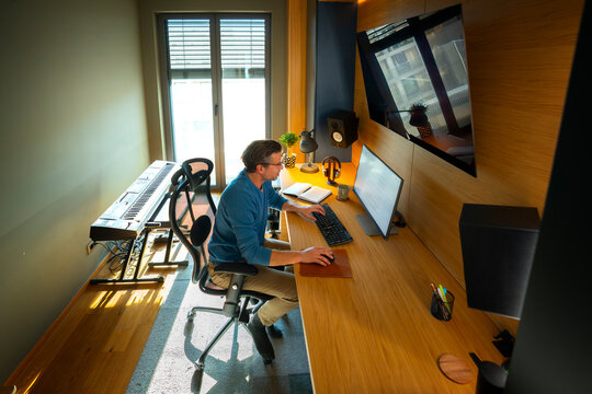 Man working at computer in modern home office