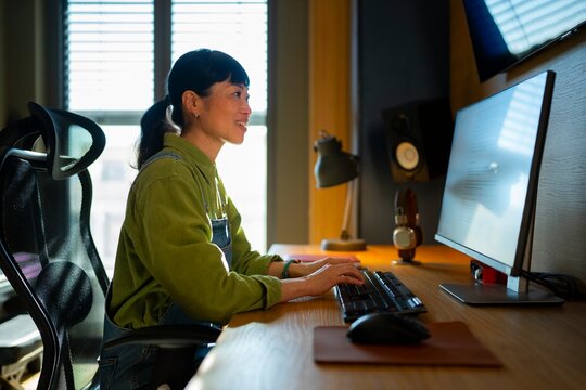 Working at a computer desk in a cozy room