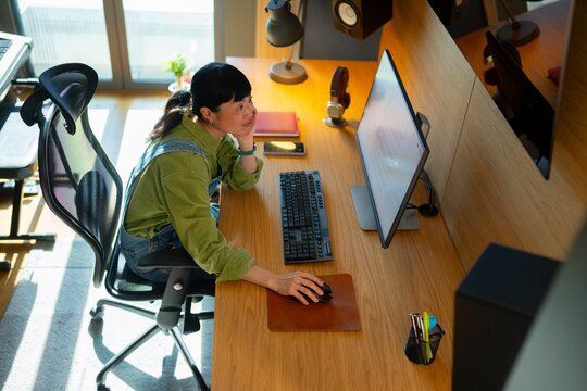 Woman working at a desk in a bright room