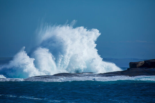 Large wave crashing onto rocks. Great Australian Bight. Australia.