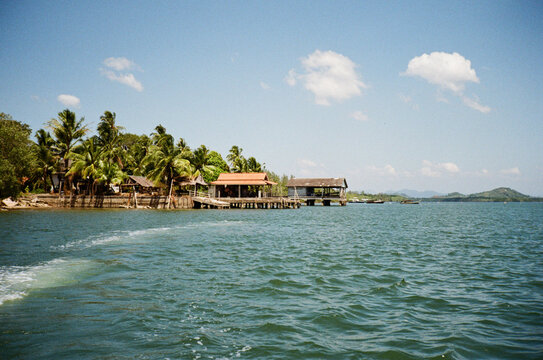 Waterfront pier, Ko Koh, Khao, with mountains in the background.