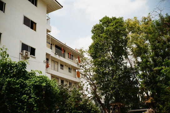 Monks' robes hanging over the balconies of Bangkok apartments.