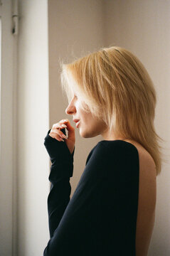 Young Woman in Profile by Window, Backless Top, Film Portrait