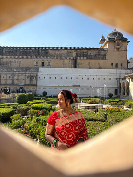 Woman in Saree Stands at a Historical Site in India