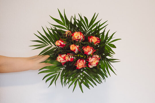 Hand Holding Rose Bouquet