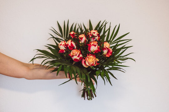 Hand Holding Rose Bouquet