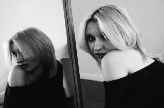 Blonde Woman and Mirror Reflection in B&W Film Portrait