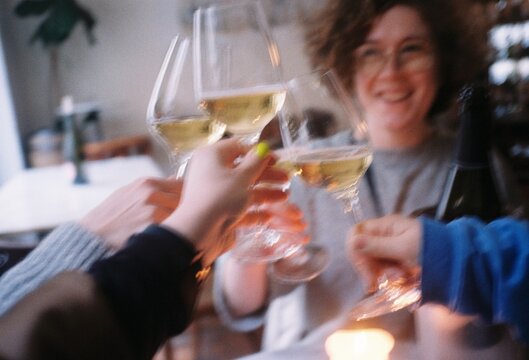 a happy smiling woman drinking champagne