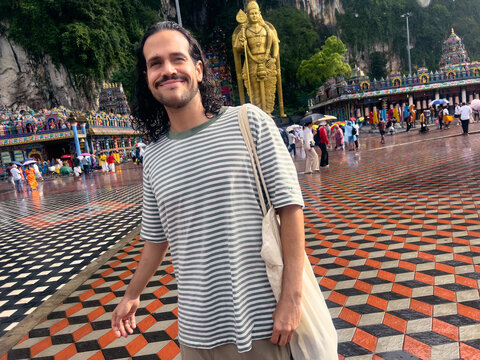 Man walking through Batu Caves temple area in Kuala Lumpur