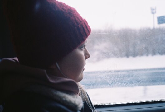a boy in a bus in winter