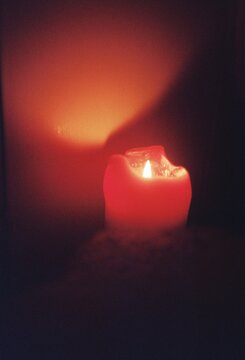 Glowing Red Candle on 35mm Film
