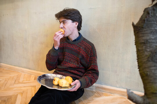 man eating pears