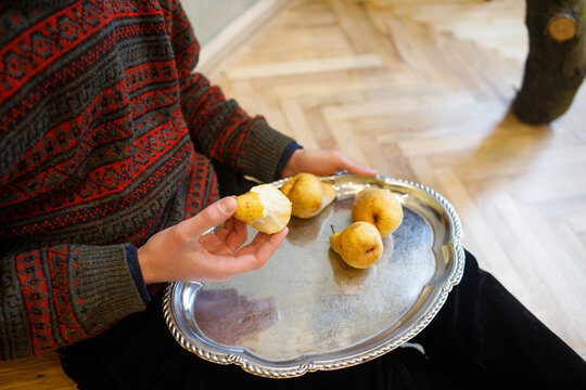 man eating pears