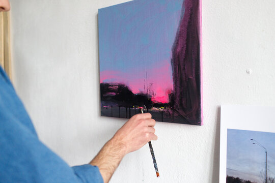 a man is painting a picture