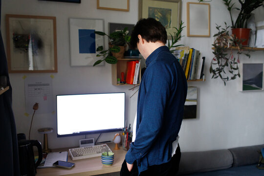 man looking at the computer