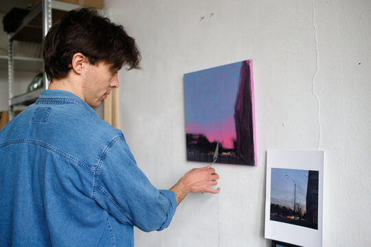 a man is painting a picture