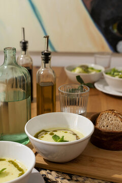 Dinner Setting With Soup, Drinks, and Bread 