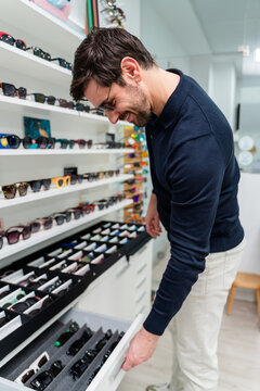 Customer Browsing Sunglasses Drawer