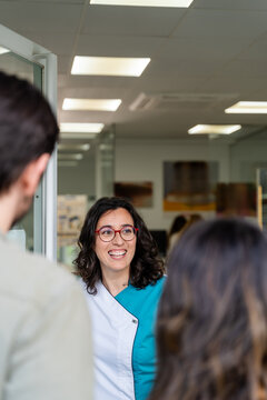 Optometrist Talking With Couple