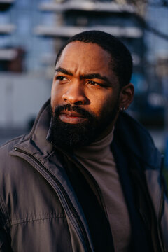 Portrait of a man wearing a jacket outdoors