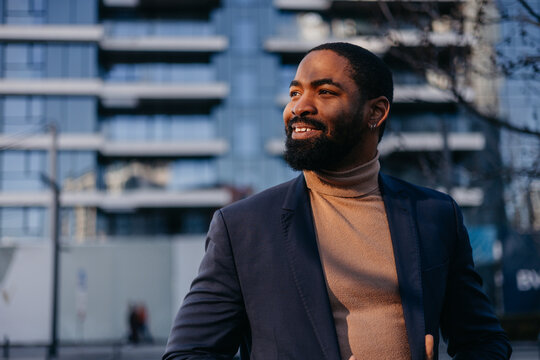 Attractive man smiles outdoors