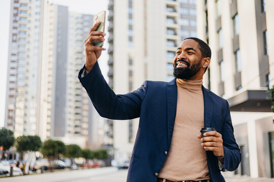Businessman enjoys his time snapping selfies outdoors