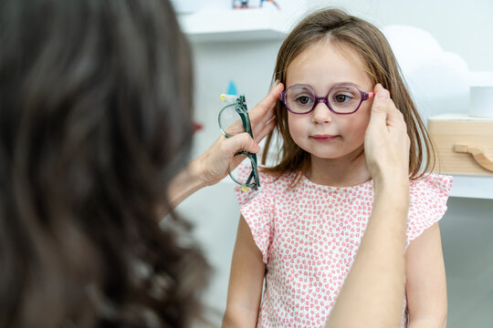 Girl Reacting During Eye Test