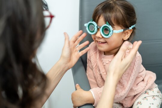 Optometrist Checking Trial Frame