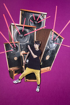 Analog collage a dancer in front of a sound system.