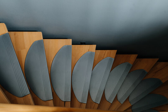 Abstract geometric detail of wooden spiral staircase