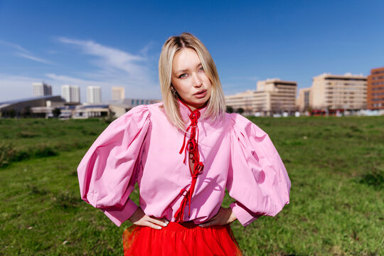 Woman posing in fashion outfit outdoors