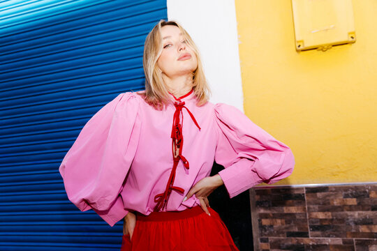 Blonde woman  in colorful street clothes
