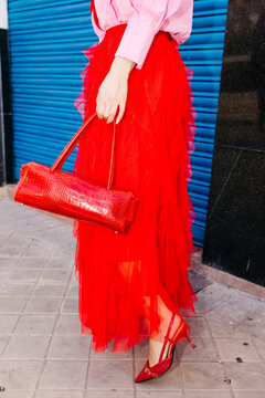 Woman wearing red skirt with accessories