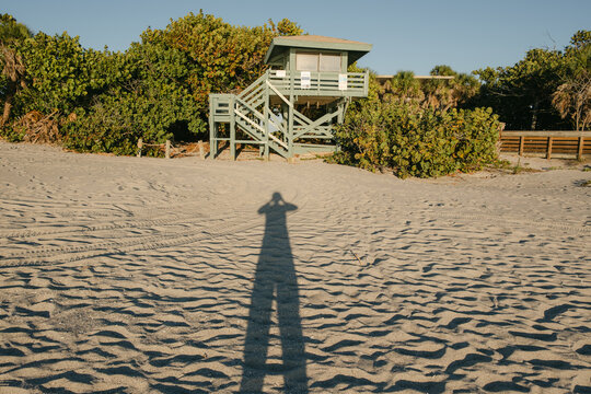 UGC elongated shadow on beach 