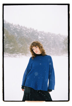 Film Portrait of a Woman in Blue Sweater During Snowfall