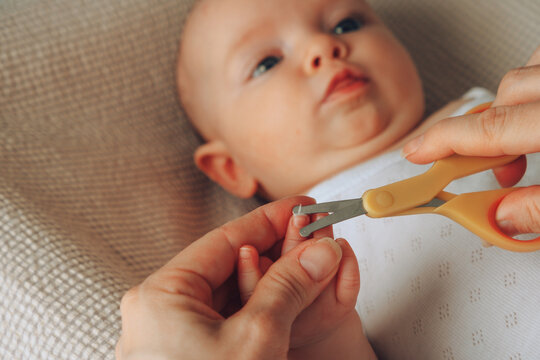 Cutting babies nails 